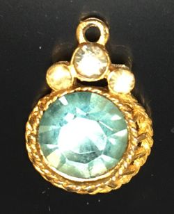 Aquamarine color pendant in gold tone filigree setting