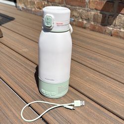 Portable milk/water warmer for baby bottles