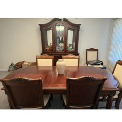 cherry wood, dining room table and chair set with mahogany inlays, has Six chairs all togethe