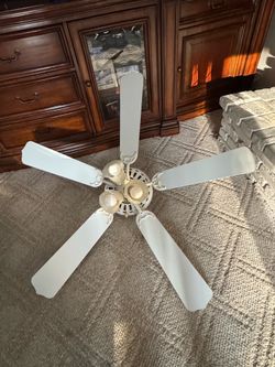 White ceiling fan and light. 5 paddles and 3 lights.