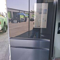 Samsung brand 4-door display refrigerator, 36 wide by 68.5 high by 29 deep, brand new, 5-month warranty.