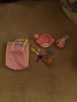 Little bag with baby stuff inside for dolls
