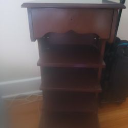 antique roller with newspaper stand 