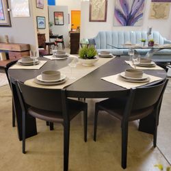 Round Carbone Oak Dining Table With 9 Black Modern Chairs