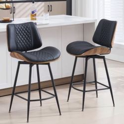 Beautiful Bentwood counter height swivel stools with faux leather upholstery.