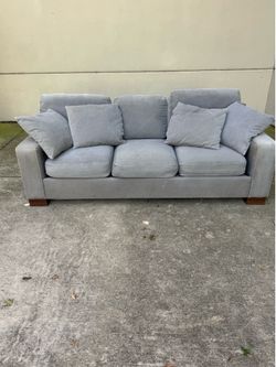 Grey couch with ottoman