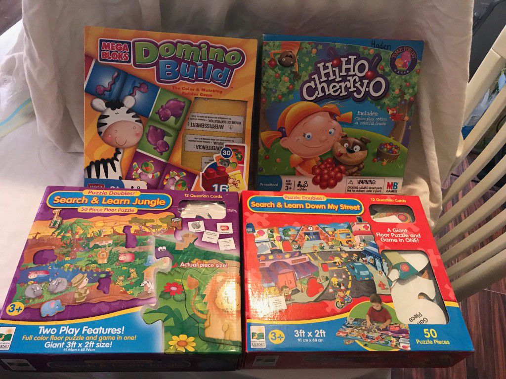 Hi-Ho Cheerio Game and Domino Mega Block and 2 giant floor puzzles.