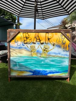 Vintage Tiki Bar with storage on back. Sturdy made of some type of metal frame