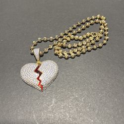 Broken heart pendant with moon cut chain