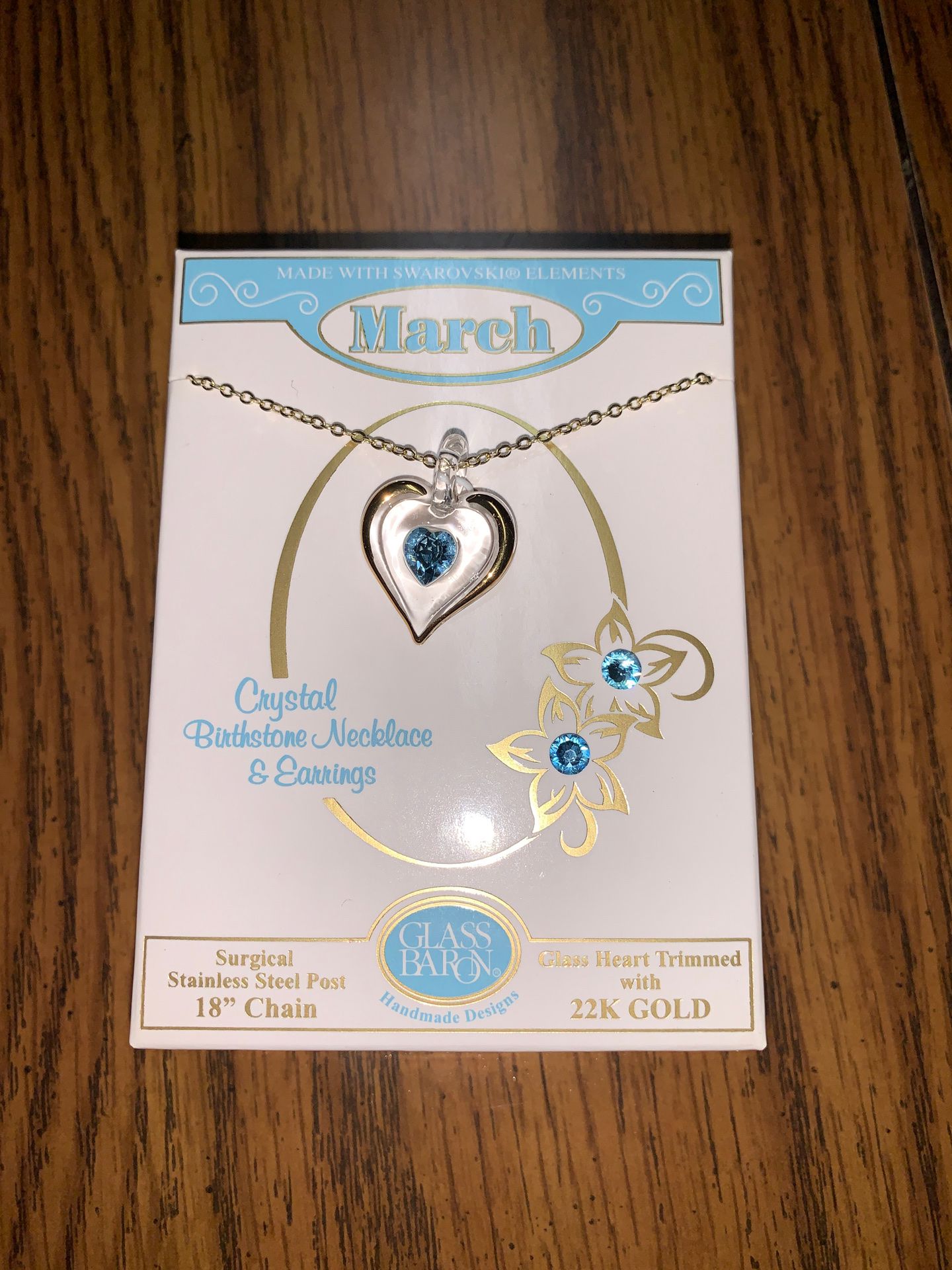 Brand new still in the box March stainless steel post 18 chain 22k gold glass heart trimmed I payed 22 asking 15 necklace and earring set