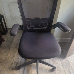 Black mesh office chair, adjustable arms