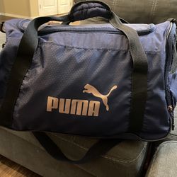 Puma rose hotsell gold duffle bag