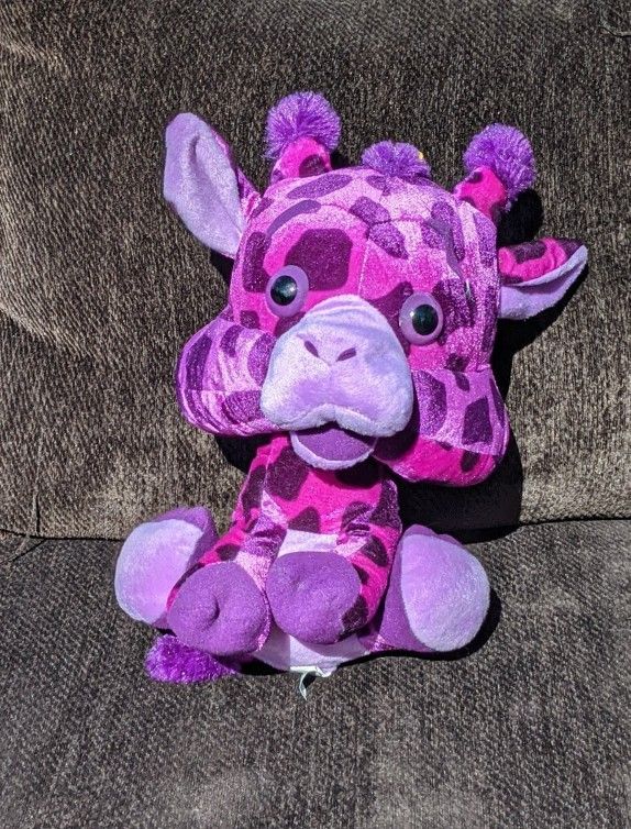 Purple giraffe stuffed toy