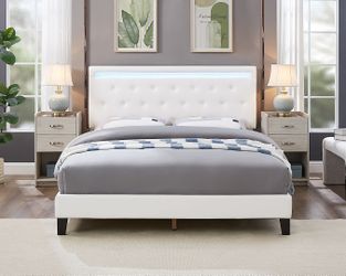 Bed with LED lights on the headboard