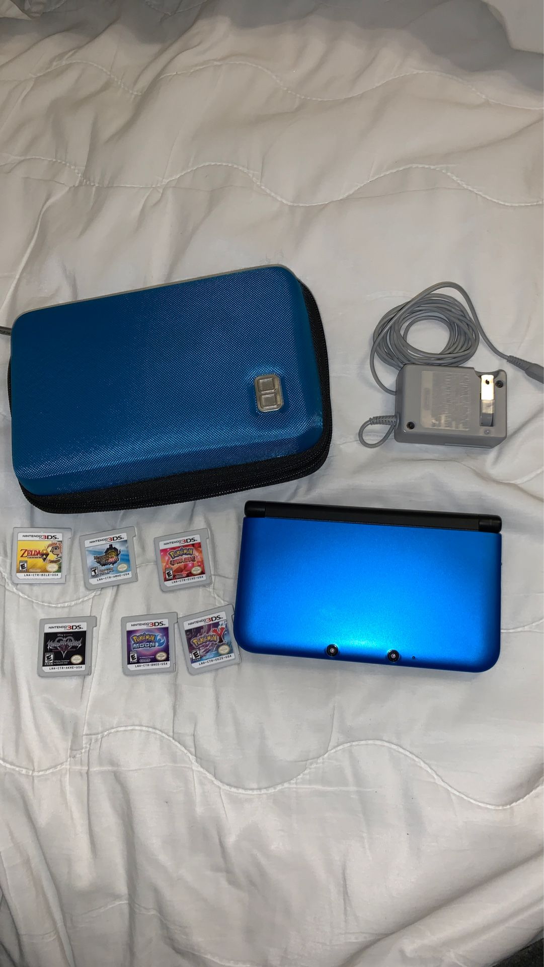 Nintendo 3DS XL with charger, case and games