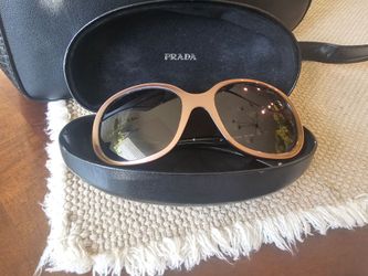 Authentic Ladies Prada Sunglasses with case purchased in Milan Italy.  Authentic Micheal Kors Purse.  Bothe EXCELENT condition.  No scratches on the g