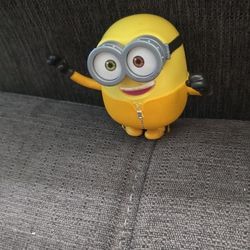 This item is a Mattel Minions: The Rise of Gru Black Belt Bob interactive toy figure. 
It is approximately 8 inches tall and features random martial a