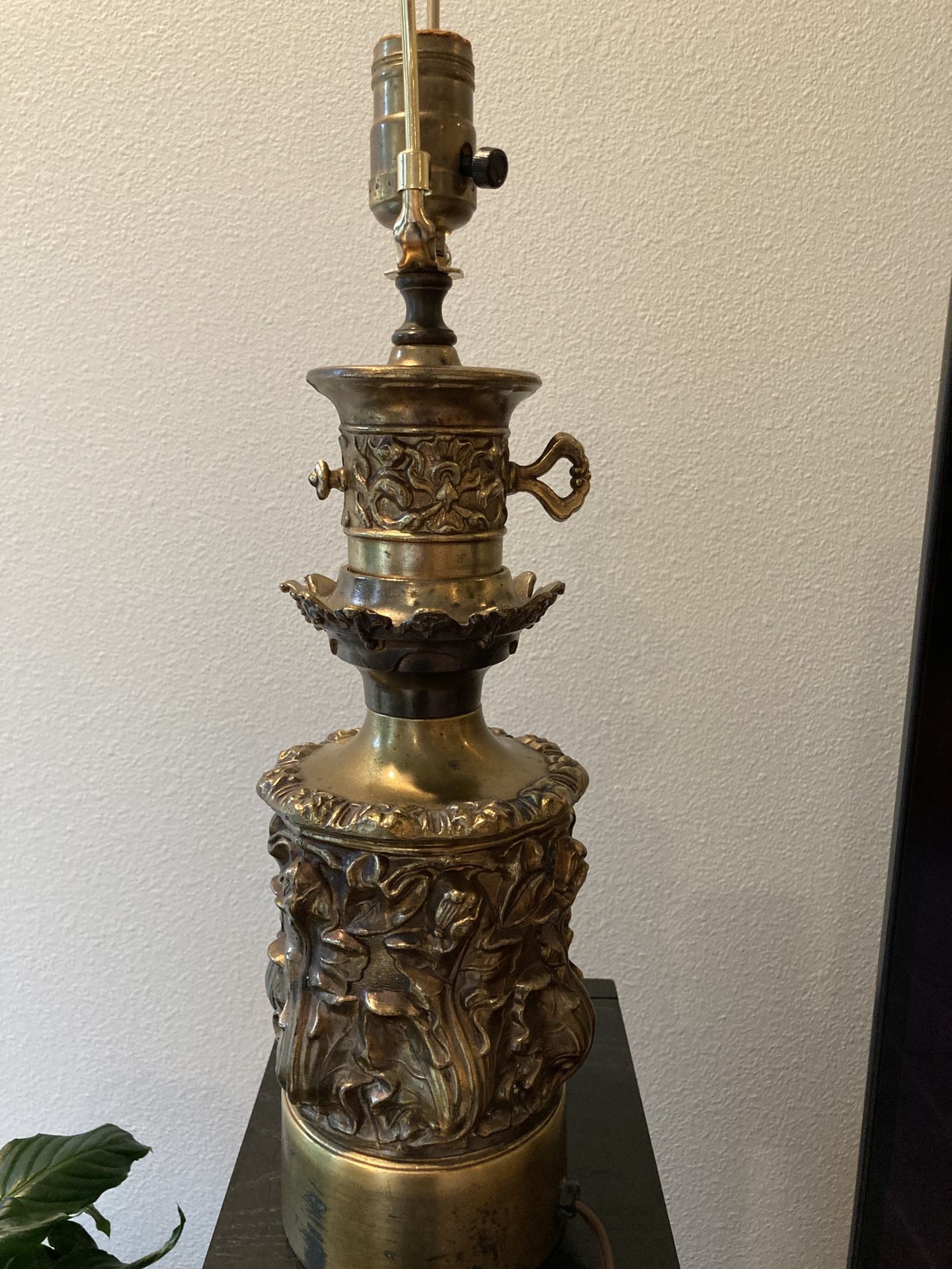 Vintage floral brass lamp 16.5" tall to top of socket. Brass is black in places at base. Some imperfections. See photos. Cord should be rewired.