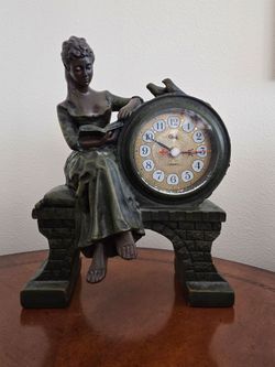 Woman reading a book statue sculpture