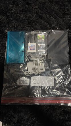 Nintendo 3ds with games and dock charger