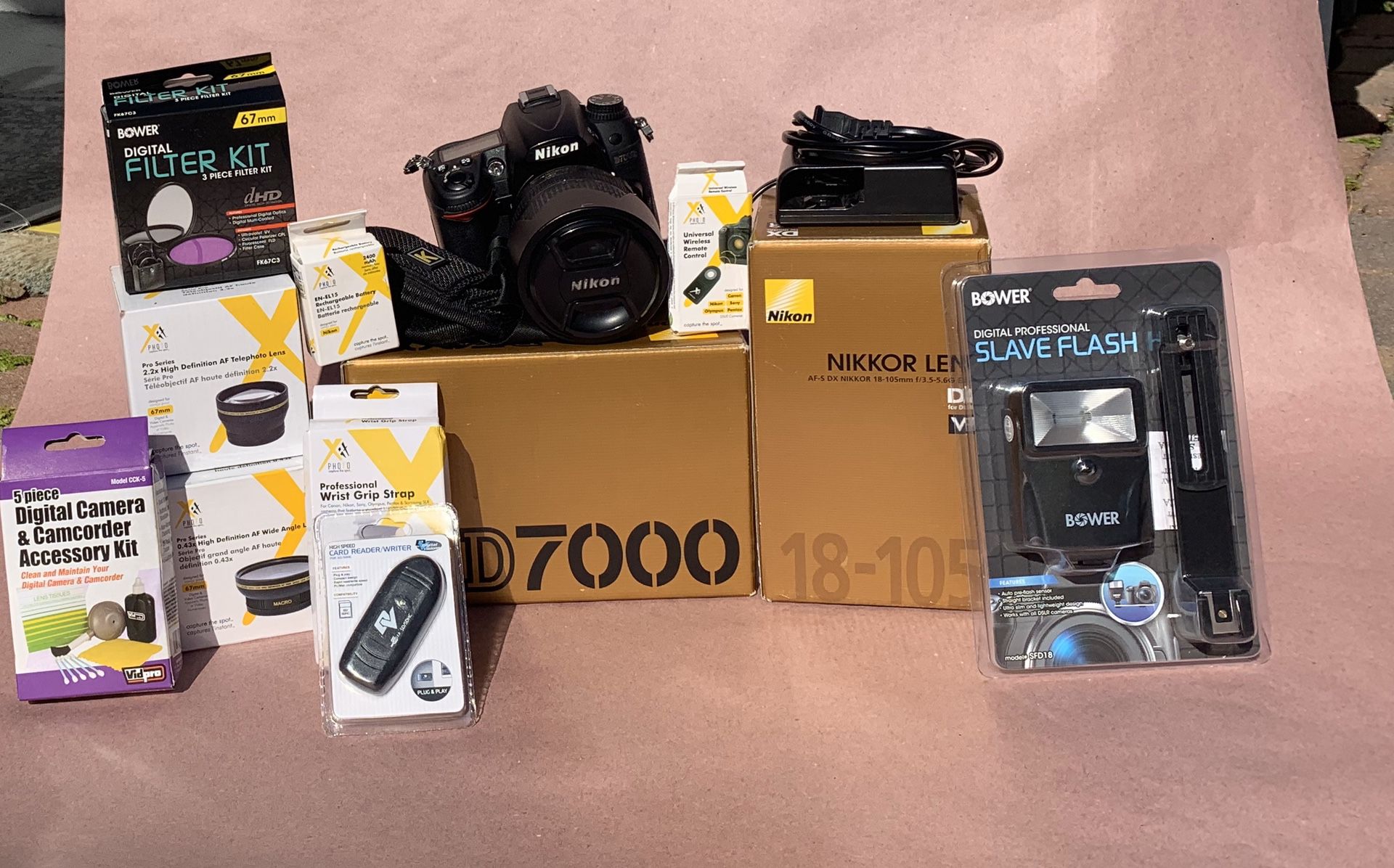 Nikon D7000 camera with strap,extra battery, charger,lenses,flash,remotes and filters.
