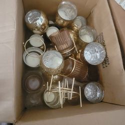 2 boxes of gold candle holders 