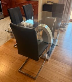 Glass dinning table and chairs