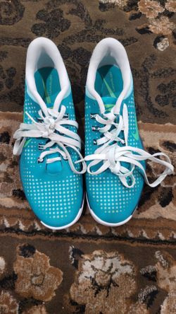 Nike Lunar Empress golf shoes in a vibrant teal color