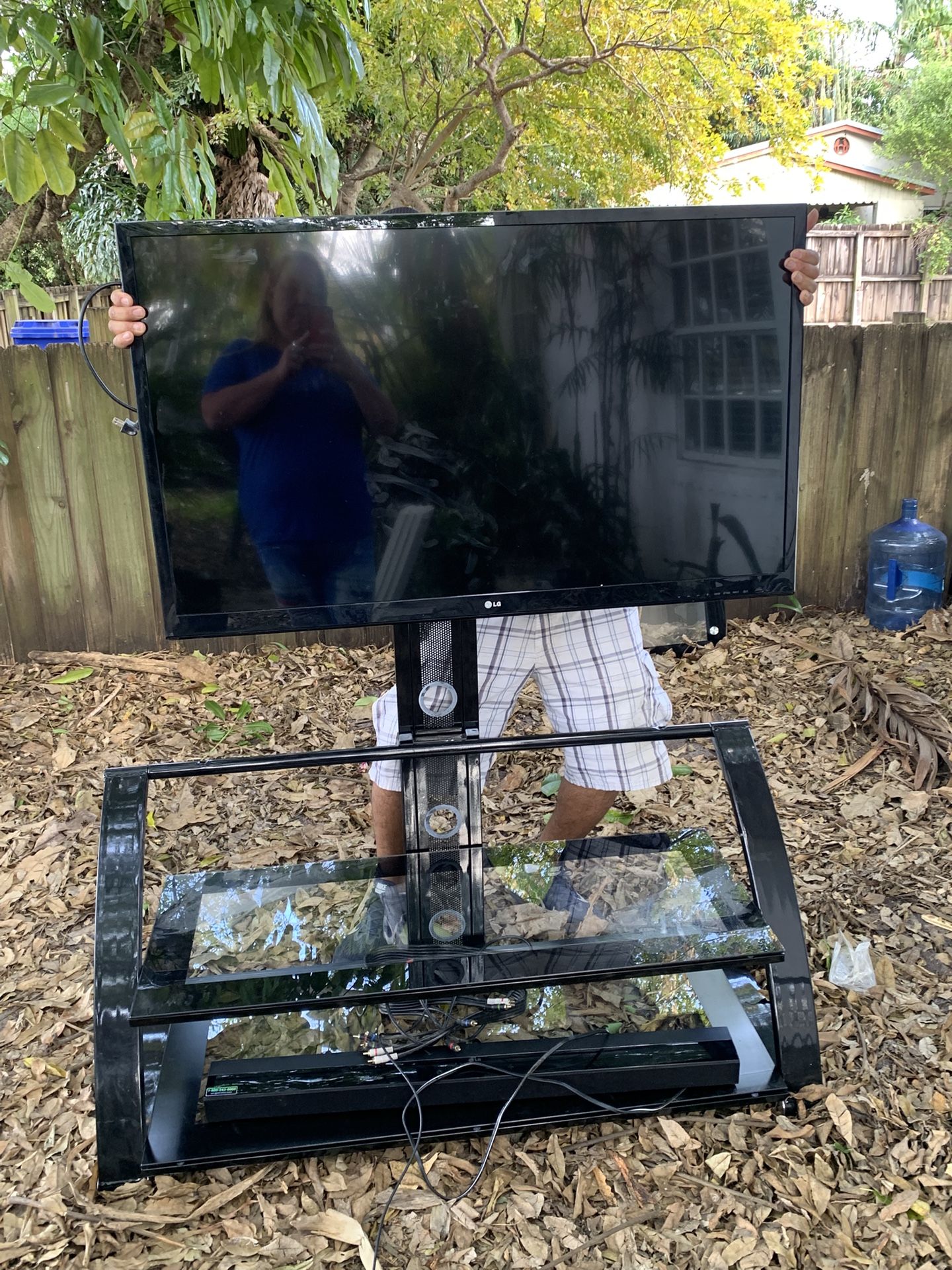 LG TV, TV stand, and LG sound bar