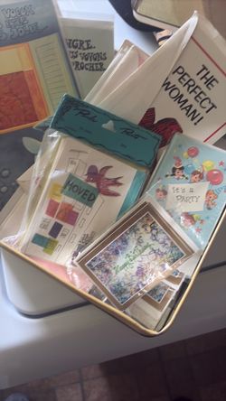Vintage tin full of vintage greeting cards