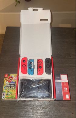 Nintendo Switch +4 Controllers and 5 Games