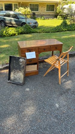 Desk and folding chair and a steel griddle free