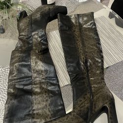 Brand new animal print over the boots size 10