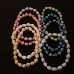 8 Solid Pearl Stretch Bracelets..
