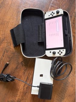 Nintendo Switch OLED with 128gb micro SD card, dock, carrying case, controller grip