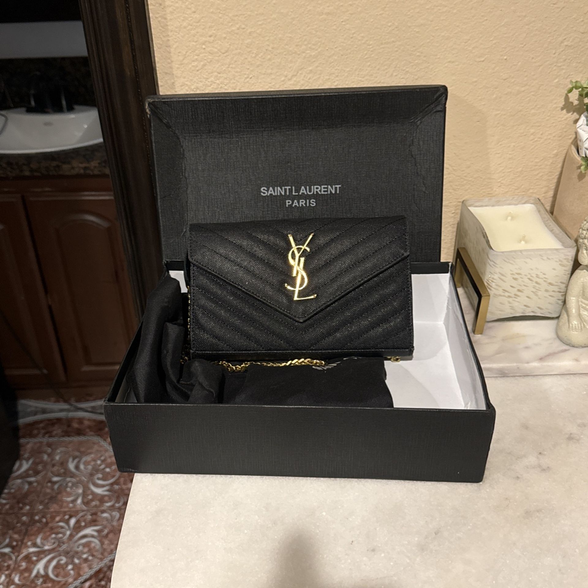 YSL black and gold envelope clutch on chain crossbody purse
