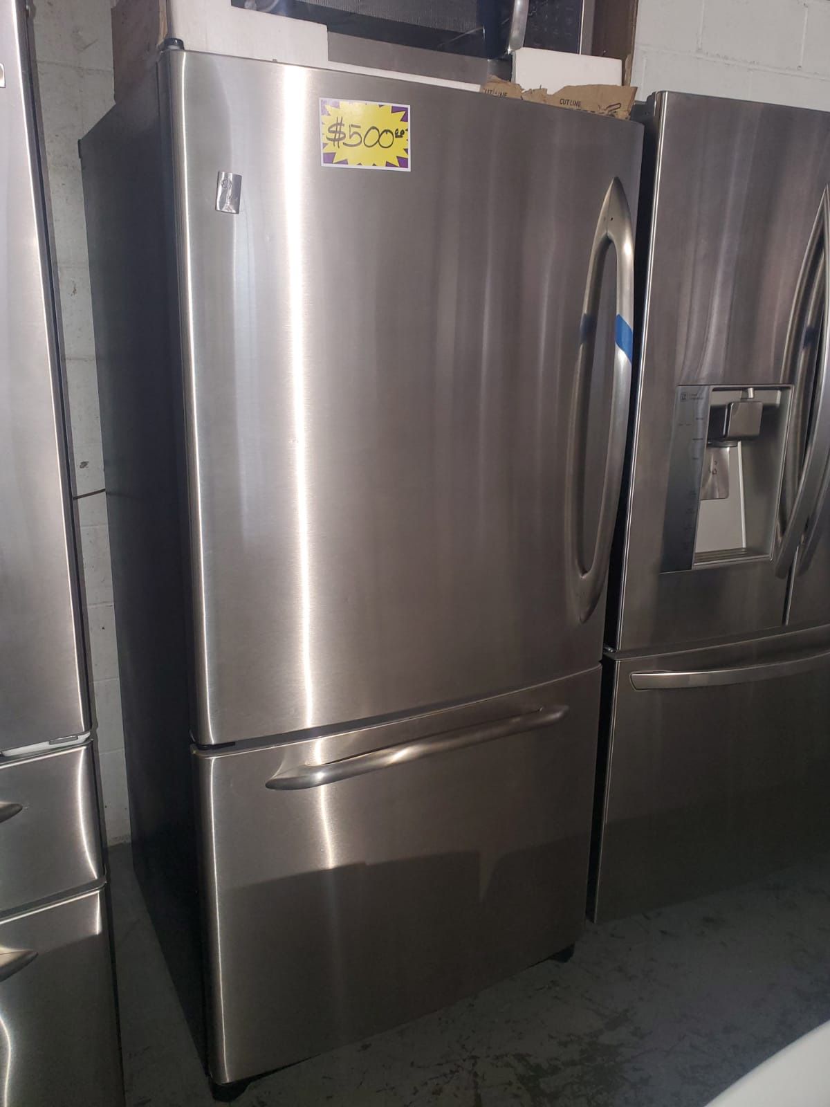 GE 33in. Bottom freezer refrigerator in excellent condition with 4 months warranty