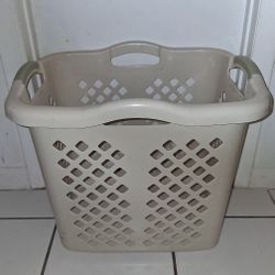 beige plastic laundry basket $5 FIRM