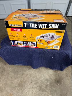7 INCHES WET SAW TILE CUTTER IN LIKE NEW CONDITION. $80.00