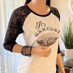 Fun, tan football tee with lace sleeves.