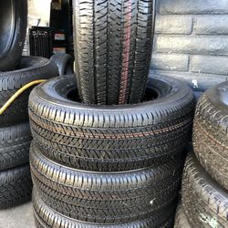 SET OF FOUR USED TIRES (BRIDGESTONE/264/65/17)