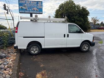 White Chevy Express Cargo Van with Roof Rack