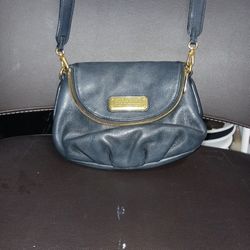 This is a black Marc by Marc Jacobs Classic Q Mini Natasha pebbled leather crossbody bag. 