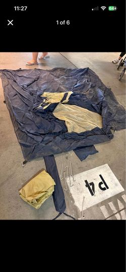 Blue and Tan Camping Tent with Stakes