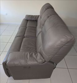 Dark Grey Leather Reclining Couch Set — $1,500 (Pair)