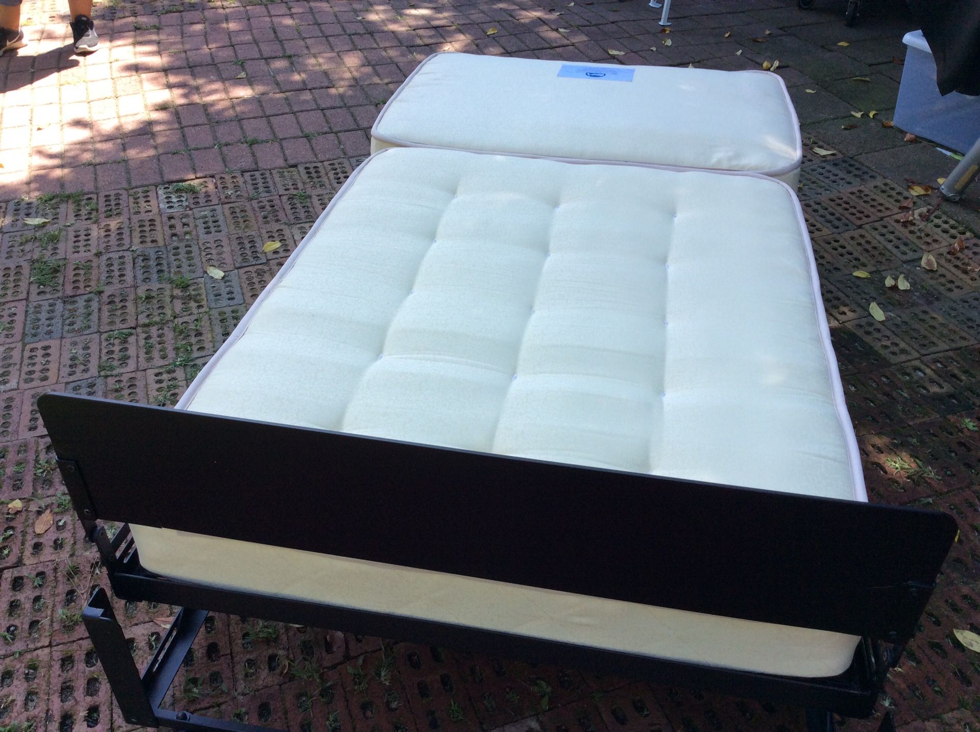 Twin bed Castro Convertible converts to ottoman with dark brown cover for Sale in Fayetteville