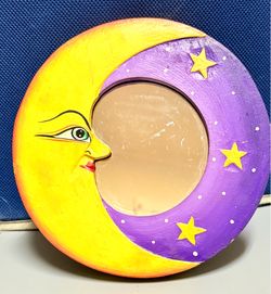 Moon with a face and stars. - Moon design with face. - Decorated with stars. - Purple and yellow border.