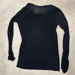 Black long sleeve top with sheer mesh detailing and a relaxed fit size small 