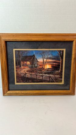 This is a framed art print titled "Simpler Times" by artist Jim Hansel, featuring a cozy lakeside log cabin, an old truck, and a scenic sunset