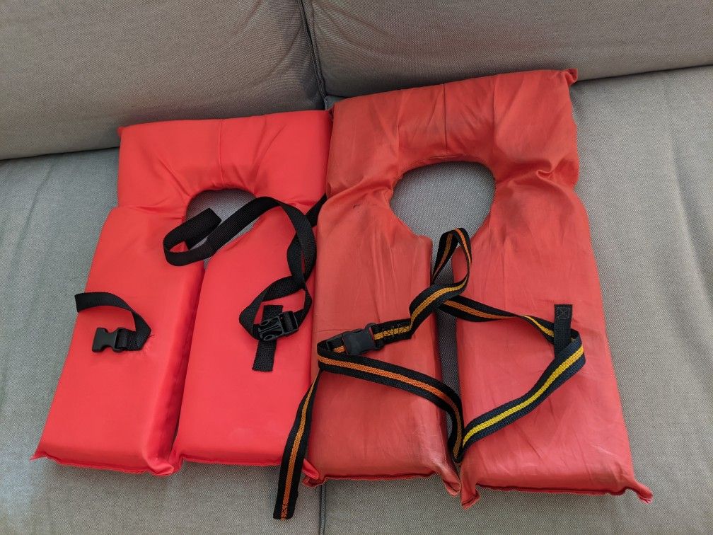 A pair of adult life jackets